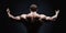 Close up of sports man\'s muscular back isolated