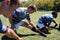 Close up of sports people exercising at grassy field