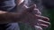 Close-up of sporty man hands clapping with talc and preparing for workout at gym