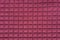 Close-up of square red pattern fabric. Textured soft background