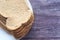 close up of stack of baked bread on table