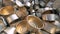 Close up of a stack of empty tin cans laying in a wooden box