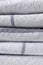 Close up stack of kitchen towels folded, macro cotton