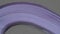 Close-up of a stack of light purple quilling stripes of paper. Macro