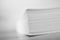 Close up of stack of papers on white background. Office: Pile of Paper