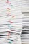 Close up stack paperwork with colorful paper clip overlap report