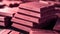 A close-up of a stack of Ruby Chocolate bars, each one detailed in
