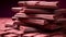 A close-up of a stack of Ruby Chocolate bars, each one detailed in