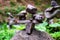 Close-up of a stack of stones in perfect balance in a mountain forest. Cairn, art of balancing rocks.