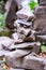 Close-up of a stack of stones in perfect balance in a mountain forest. Rock pyramid, rock balancing art.