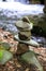 Close-up of a stack of stones in perfect balance in a mountain forest. Rock pyramid, rock balancing art.