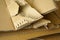 Close-up of stacked corrugated cardboard. Sheets of brown corrugated cardboard