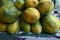 Close up of stacked green and ripen Papayas for sell at a marketplace