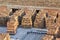 Close-up stacks of red brick neatly piled on concrete foundation