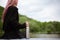 Close-up of stainless bottle in hand of young girl with pink hair.