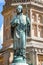 Close up  of statue of Bishop Roger on the Digby Memorial Cross in front of Sherborne Abbey in Sherborne, Dorset, UK