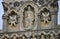 Close up of a statue on the impressive West facade of Wells Cathedral in Somerset