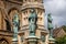 Close up  of statues of Sir Francis Drake, St Aldhelm and Bishop Roger on the Digby Memorial Cross in front of Sherborne Abbey in