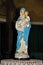 Close-up of statuette with image of Our Lady holding the boy Jesus.