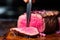 close-up of a steak being cut open to reveal pink inner meat