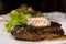 Close Up of Steak Topped with Herbed Butter