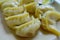 Close up of steamed Momo served in a white plate. A popular Nepalese food that is also common in Chiana, Bhutan, Tibet