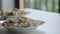 Close up steaming hot Chinese dumplings in plates on table