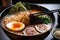 close-up of steamy bowl of ramen, with thick broth and plentiful toppings