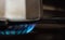 Close-up of Steel Coffee Maker on a Gas Cooker with Blue Flame