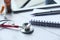 Close up of stethoscope, notepad and pills on table