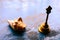 Close up Still Life of antique Conch shell and a bell on rustic floor. Faith, Tradition, Spirituality, Prayer, symbols of peace