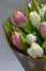 Close-up Still life Bouquet of white and pink unblown tulips, selective focus