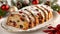 Close up of stollen bread on white tabletop, emphasizing bright colors and clean lines