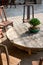 Close up of stone round table and wooden stools in Chinese garden