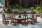 Close up of stone round table and wooden stools in Chinese garden