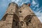 Close-up of stone watch-tower and flag in the Gravensteen Castle at Ghent.