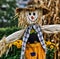 Close up of straw scarecrow with hat over blurred background