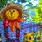 Close up of straw scarecrow with hat over blurred background