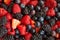 Close up of Strawberries, blackberries, raspberries, blueberries mixed together with sugar