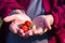 Close-up of strawberries on palm senior woman. Healthy fruits concept