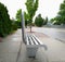Close-up of a street steel bench with an backrest