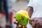 Close up of an street vendor man cutting a mango in the city of Cali in Colombia