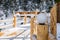 Close up on streetlight on wooden bridge in a snow-covered skiing town