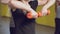 Close up of strong female hands doing strength exercises with dumbbells during group pilates training in the gym