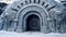 A close-up of the structure\\\'s entrance, which is made of a large, curved door. Created with Generative AI