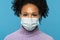 Close up studio portrait of Afro American woman wear face medical mask during covid-19, coronavirus outbreak or flu season,