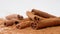 Close up studio shot of food ingredient. A pile of brown dried cinnamon sticks laying on the white background with