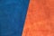 Close up suede navy blue and orange leather divide at half ratio