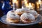 A close-up of sufganiyot, a traditional Hanukkah treat that are golden brown and dusted with powdered sugar