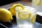 close-up of summer lemonade, with ice cubes and slice of lemon visible